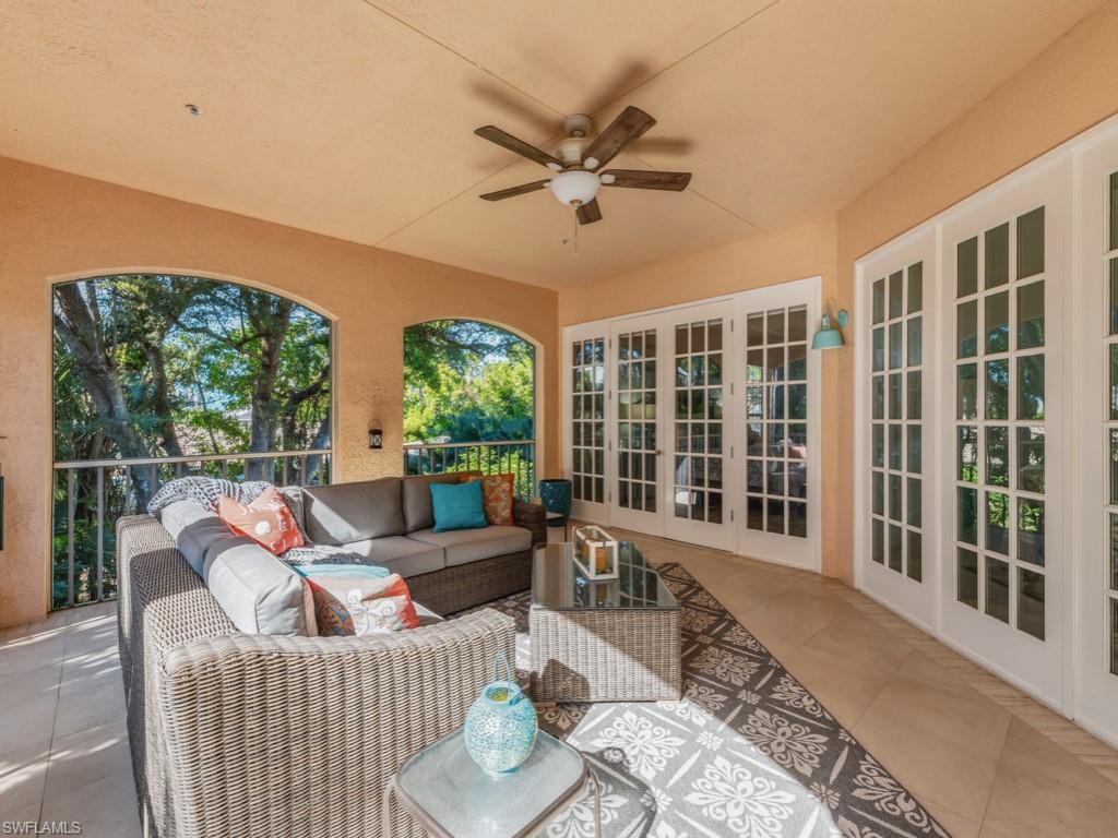 175 Colonade Circle Naples, FL 34103 - Photo 21 of 45 a living room with furniture and a large window