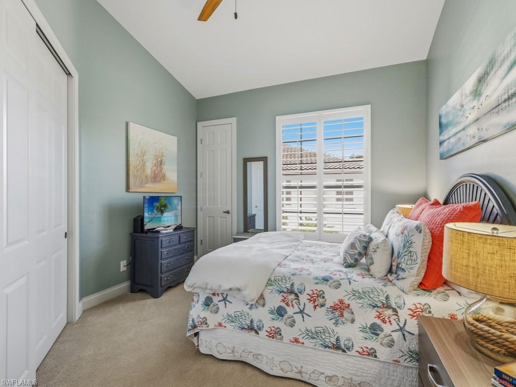175 Colonade Circle Naples, FL 34103 - Photo 28 of 45 a bedroom with a bed and a window