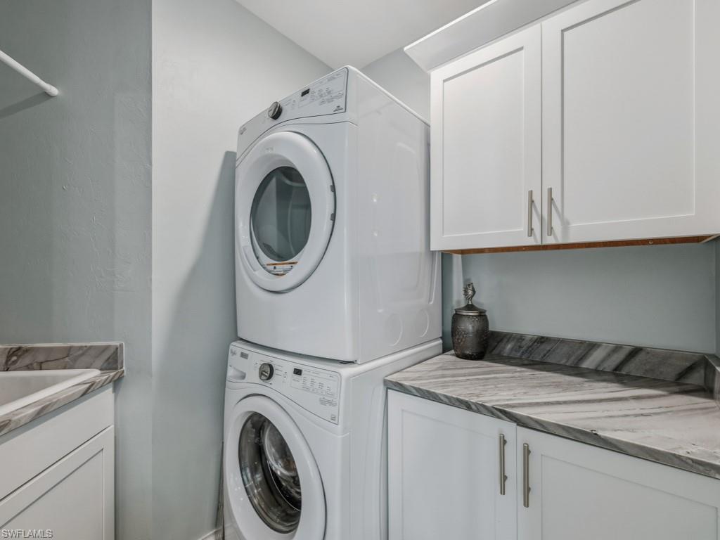 175 Colonade Circle Naples, FL 34103 - Photo 31 of 45 a utility room with dryer and washer