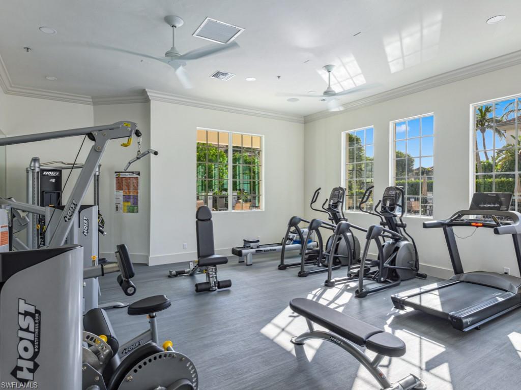 175 Colonade Circle Naples, FL 34103 - Photo 37 of 45 a room with gym equipment and windows