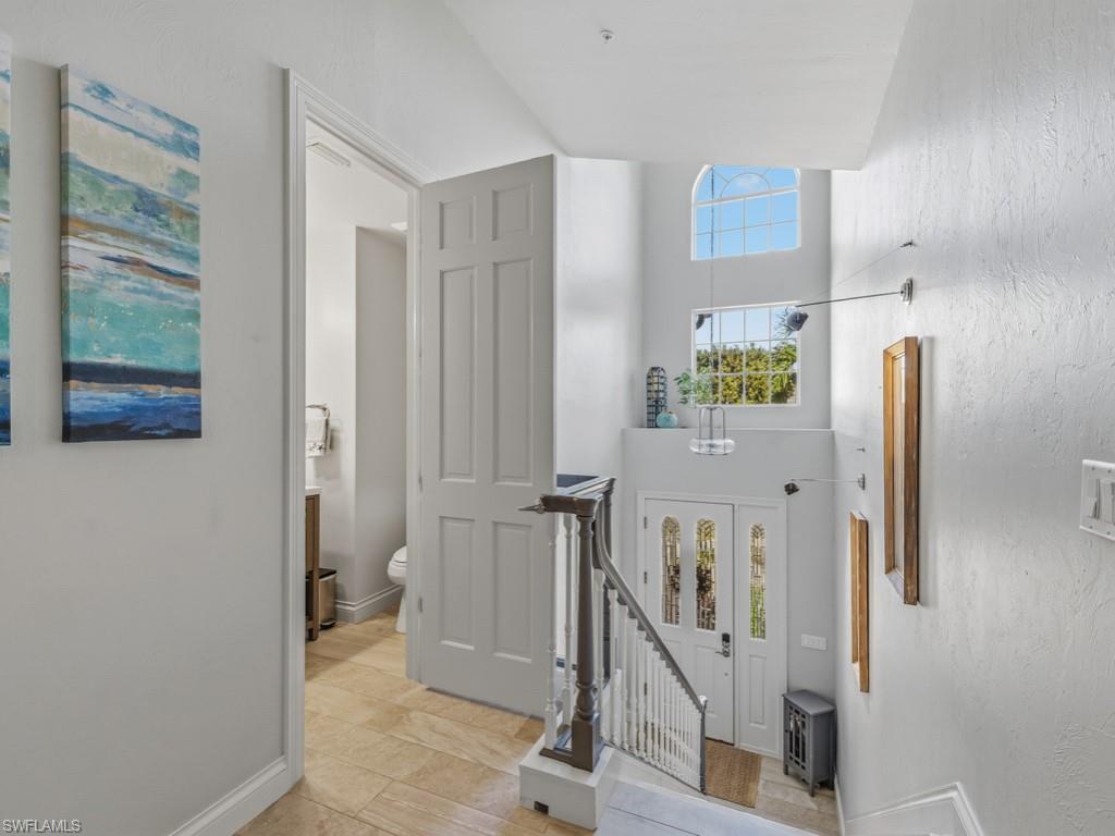 175 Colonade Circle Naples, FL 34103 - Photo 5 of 45 a view of a hallway with entryway door