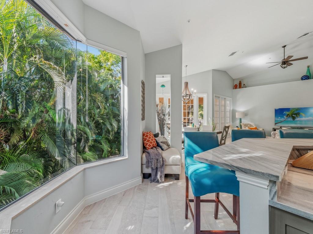 175 Colonade Circle Naples, FL 34103 - Photo 10 of 45 a view of a dining room with furniture window and outside view
