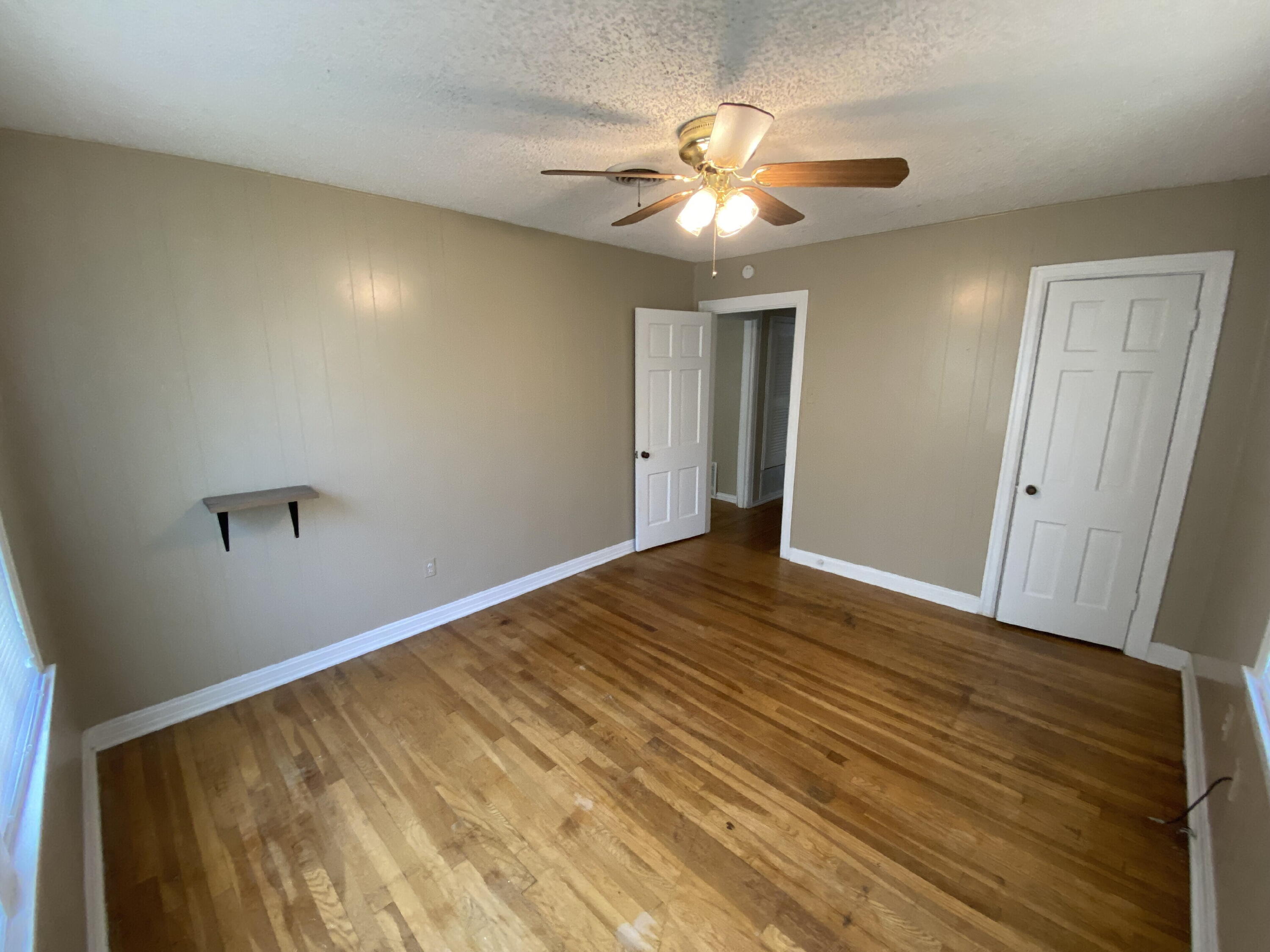 2520 27th Street, Unit FRONT Lubbock, TX 79410 - Photo 9 of 17 a view of empty room with wooden floor