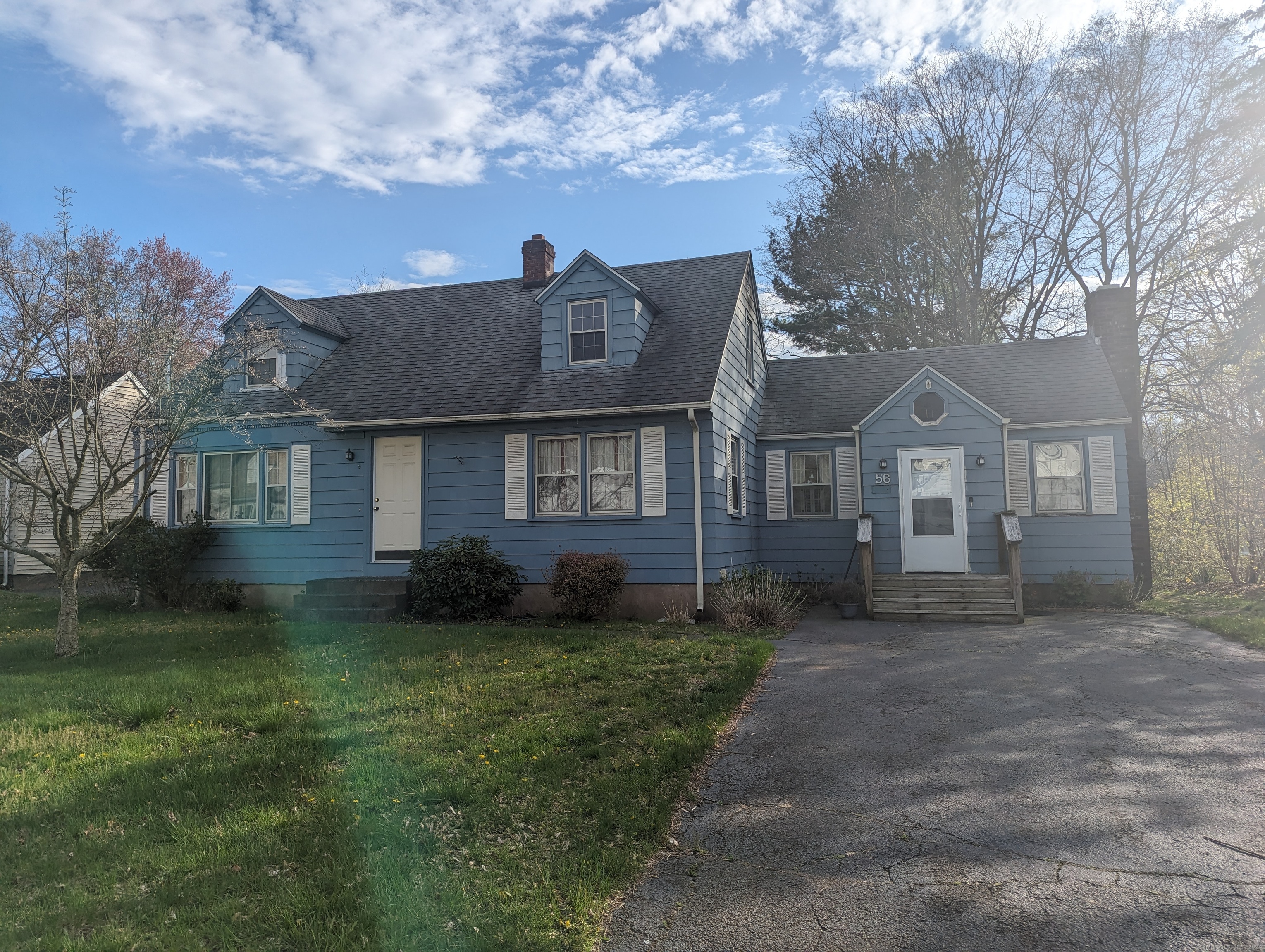 56 David Drive East Haven, CT 06512 - Photo 1 of 1 a front view of a house with a garden