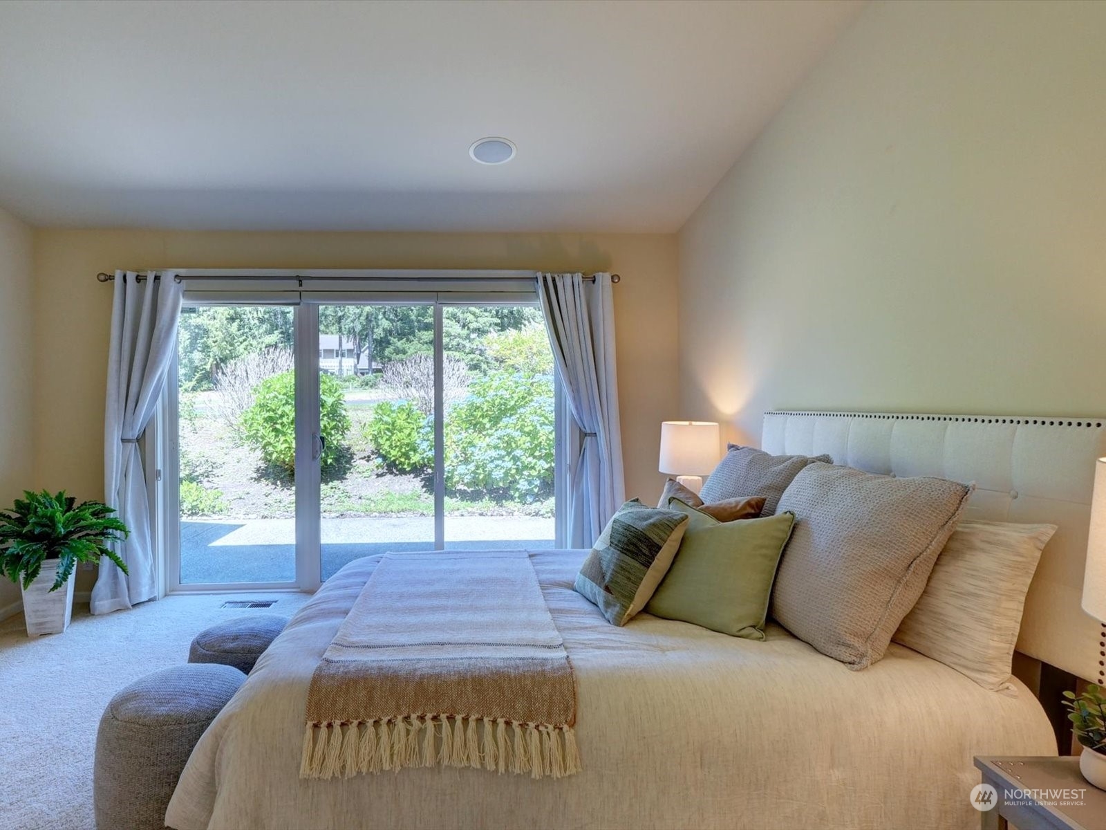 160 East Soderberg Road, Unit C9 Allyn, WA 98524 - Photo 16 of 34 a bed sitting in a bedroom next to a window