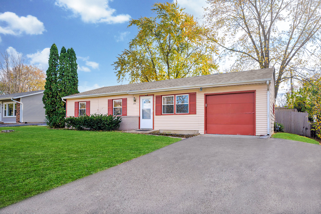 213 Rockhurst Road Bolingbrook, IL 60440 - Photo 1 of 14 a view of a house with a yard and garage