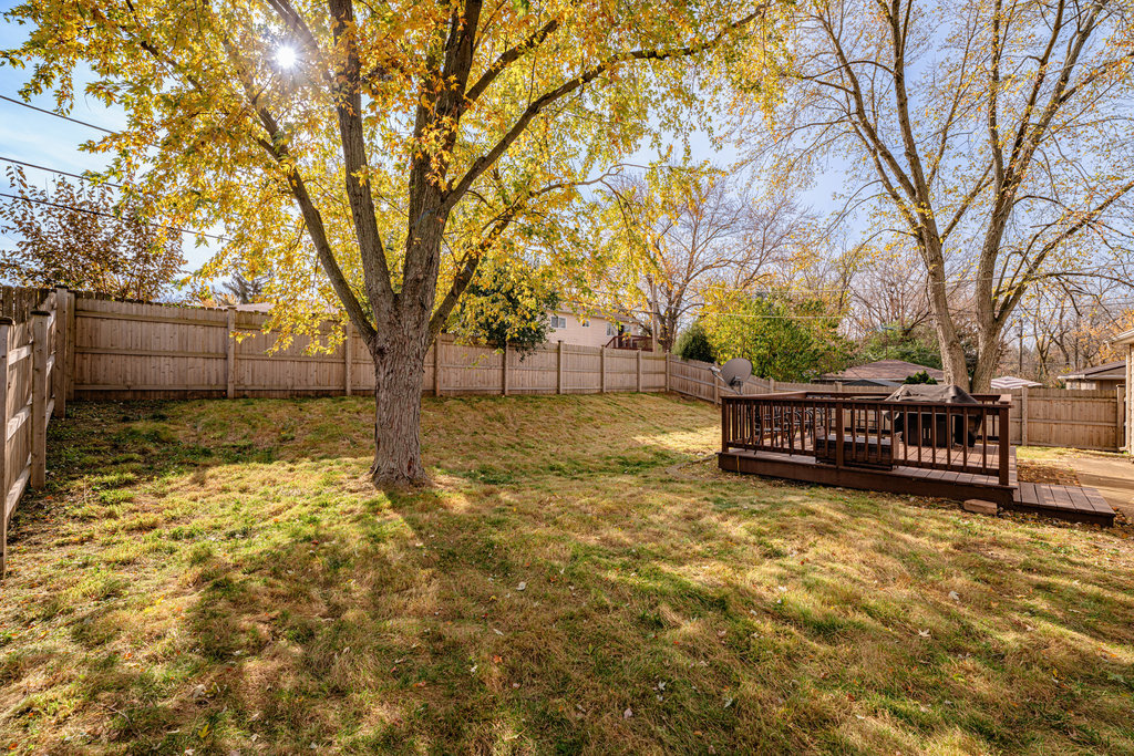 213 Rockhurst Road Bolingbrook, IL 60440 - Photo 13 of 14 a view of a yard with wooden fence