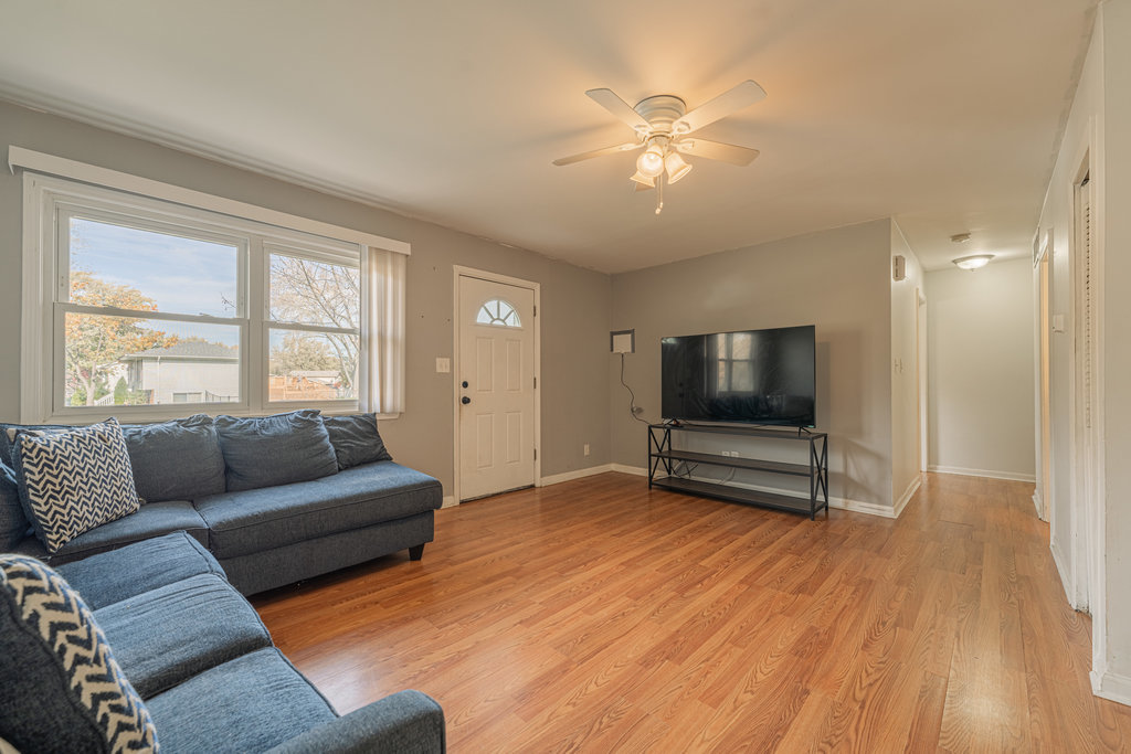213 Rockhurst Road Bolingbrook, IL 60440 - Photo 3 of 14 a living room with furniture and a flat screen tv
