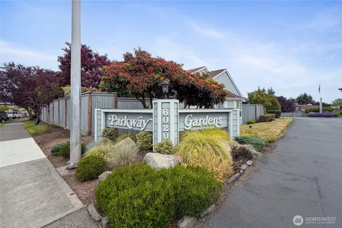 a view of a street with sign on the side of it