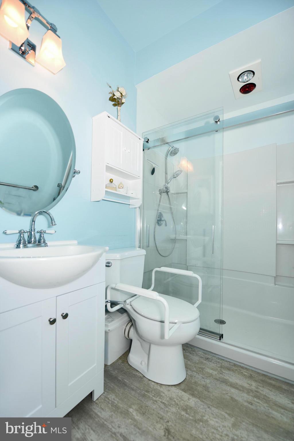 4505 King George Court Nottingham, MD 21236 - Photo 15 of 30 a bathroom with a sink toilet mirror and shower