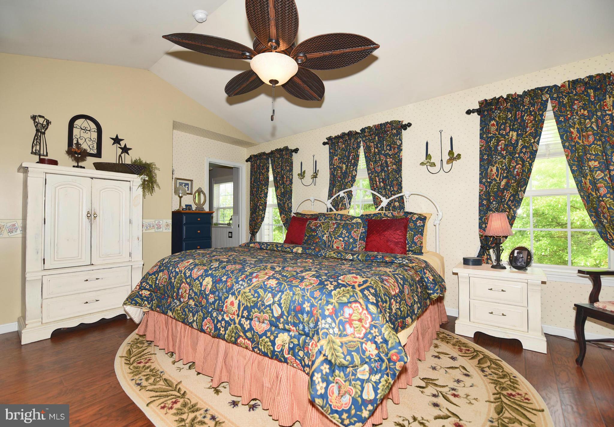 4505 King George Court Nottingham, MD 21236 - Photo 16 of 30 a bedroom with a bed and a chandelier