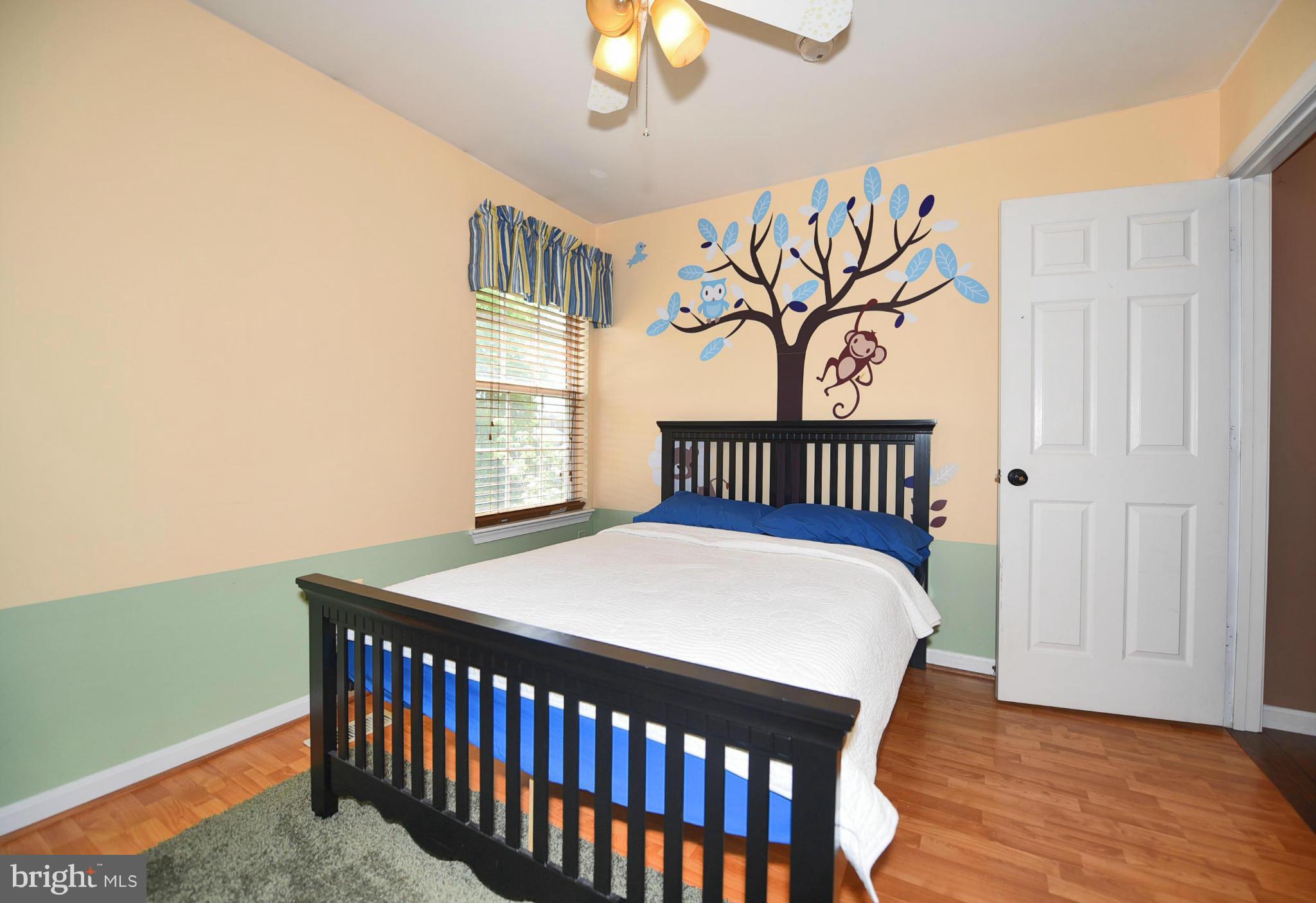 4505 King George Court Nottingham, MD 21236 - Photo 19 of 30 a bedroom with a bed and a window