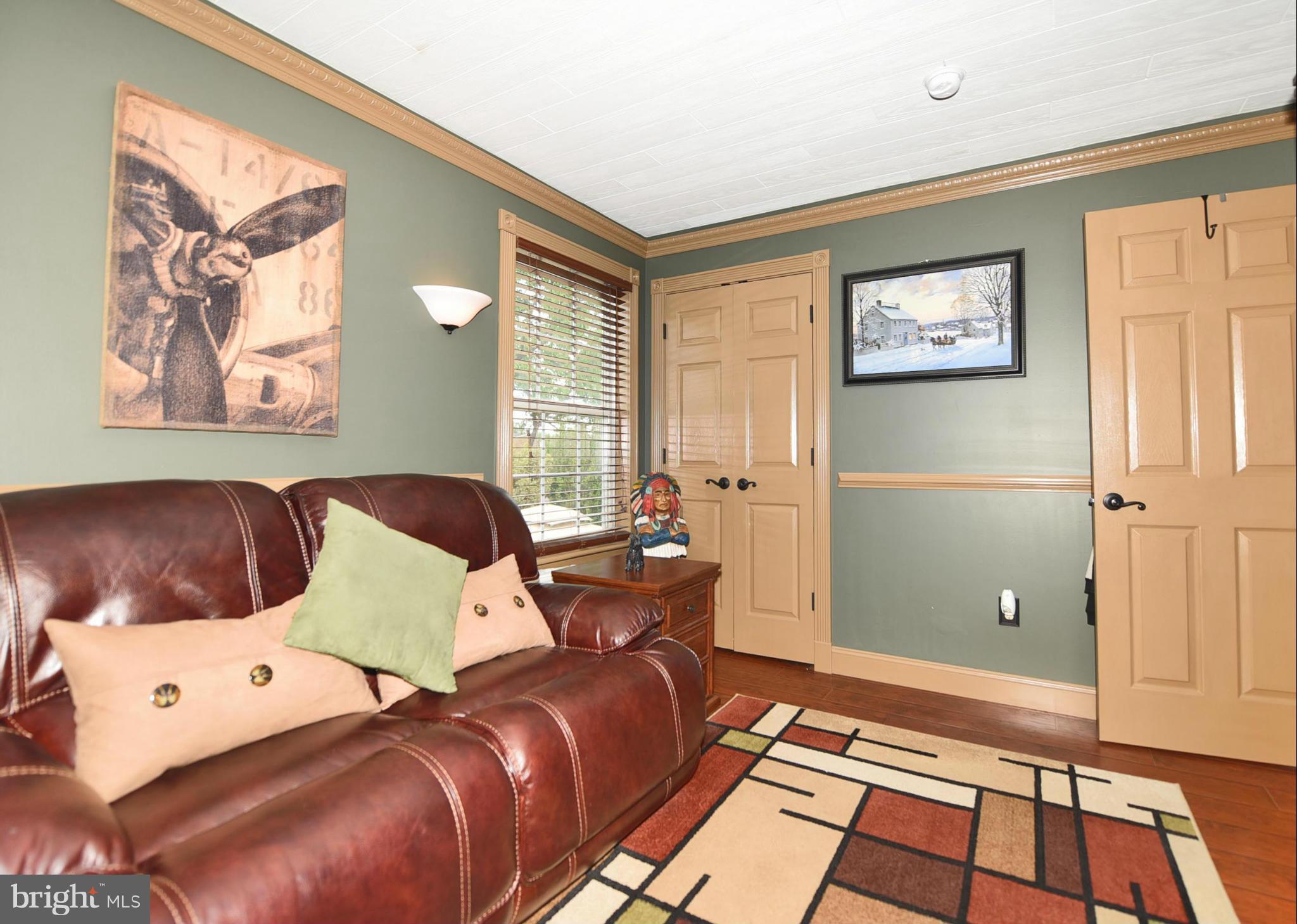 4505 King George Court Nottingham, MD 21236 - Photo 20 of 30 a bedroom with a bed and wooden floor