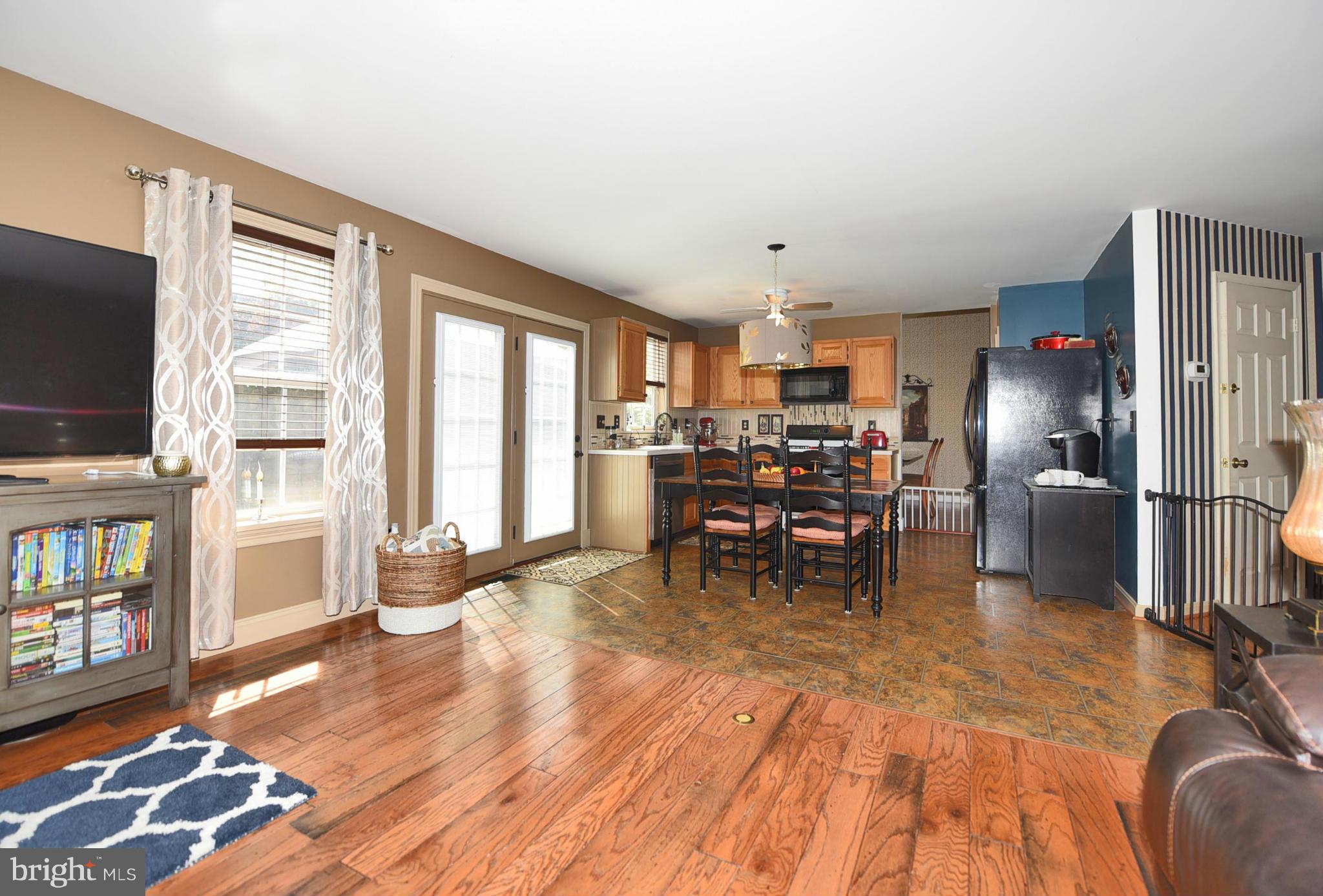 4505 King George Court Nottingham, MD 21236 - Photo 3 of 30 a dining room with furniture and wooden floor