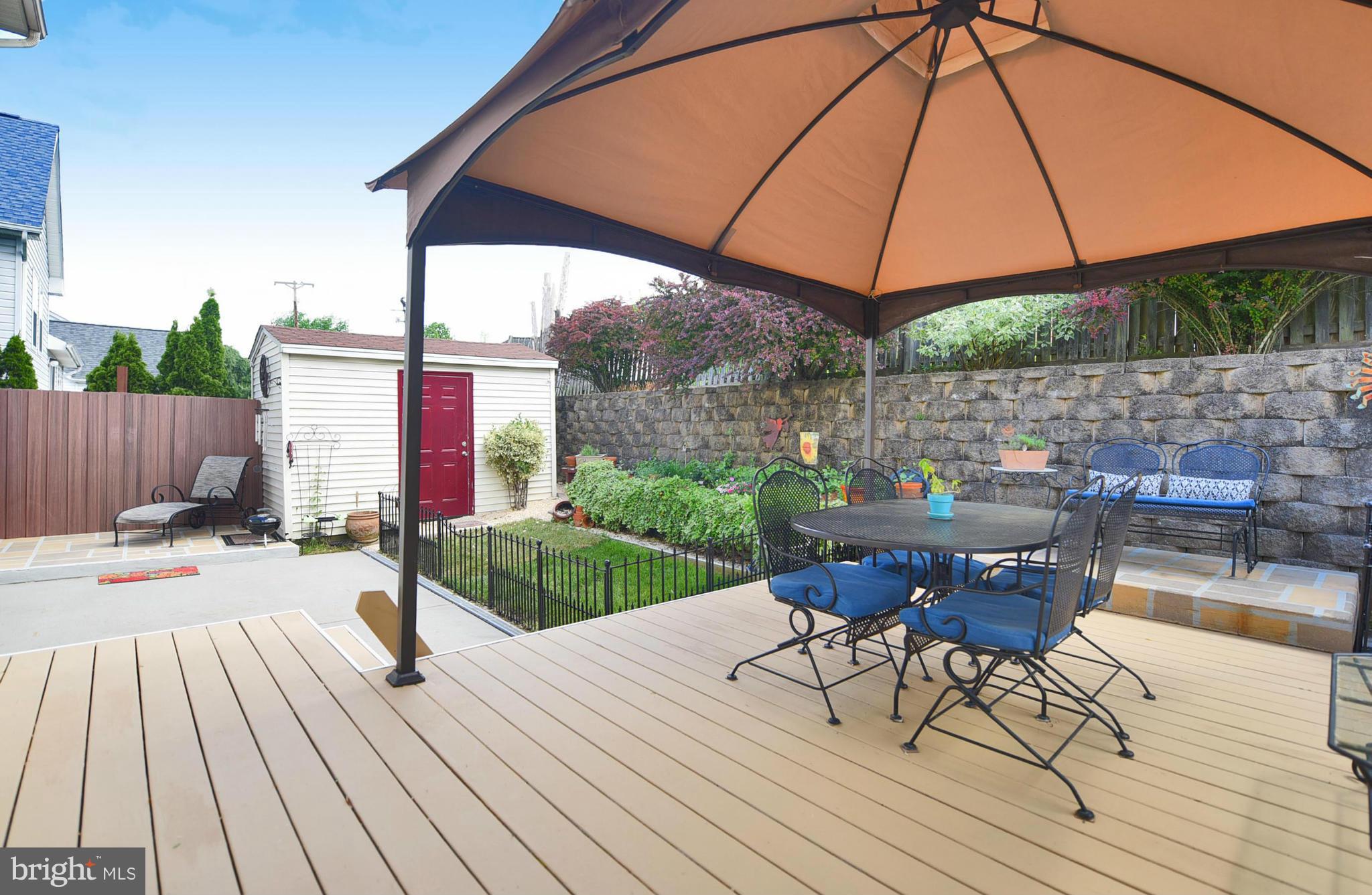 4505 King George Court Nottingham, MD 21236 - Photo 25 of 30 a view of a patio with table and chairs under an umbrella