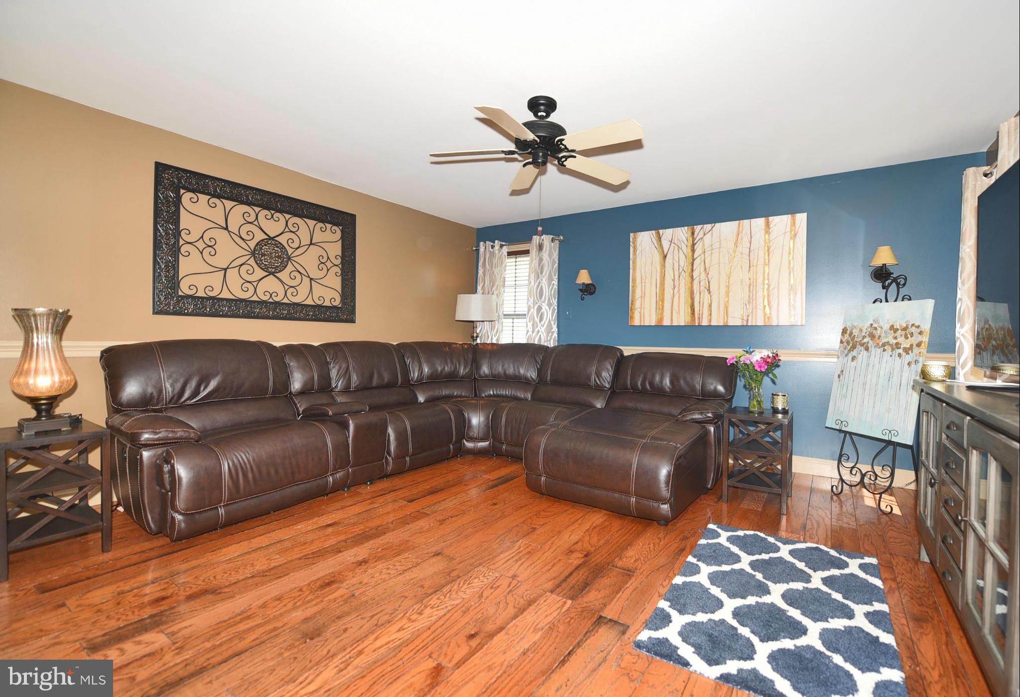 4505 King George Court Nottingham, MD 21236 - Photo 7 of 30 a living room with furniture and a chandelier