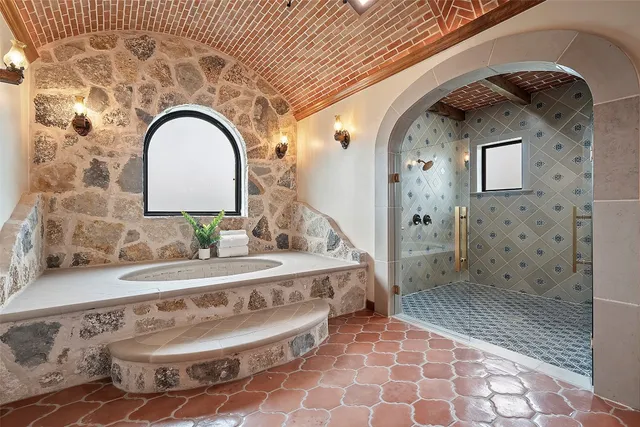 a view of a white house with a big yard plants and large trees