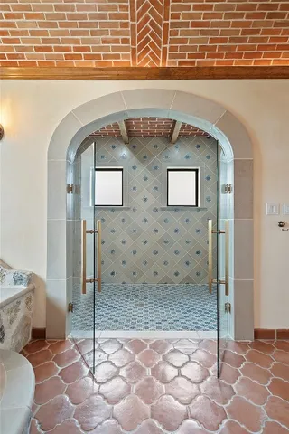 an aerial view of a house with outdoor space swimming pool