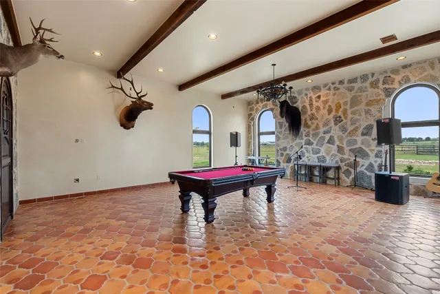 a view of a living room and hall with a large window