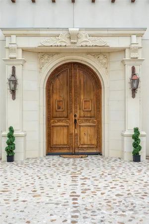 a view of a livingroom with wooden floor and a chandelier