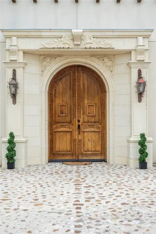 a view of a livingroom with wooden floor and a chandelier