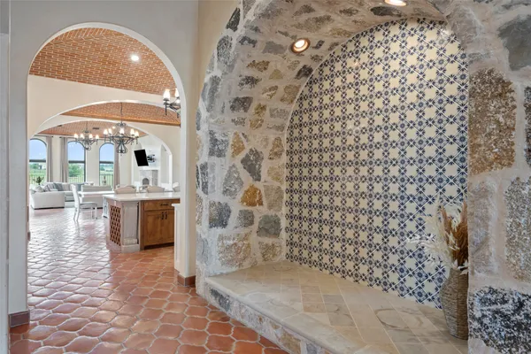 a room with pool table and windows