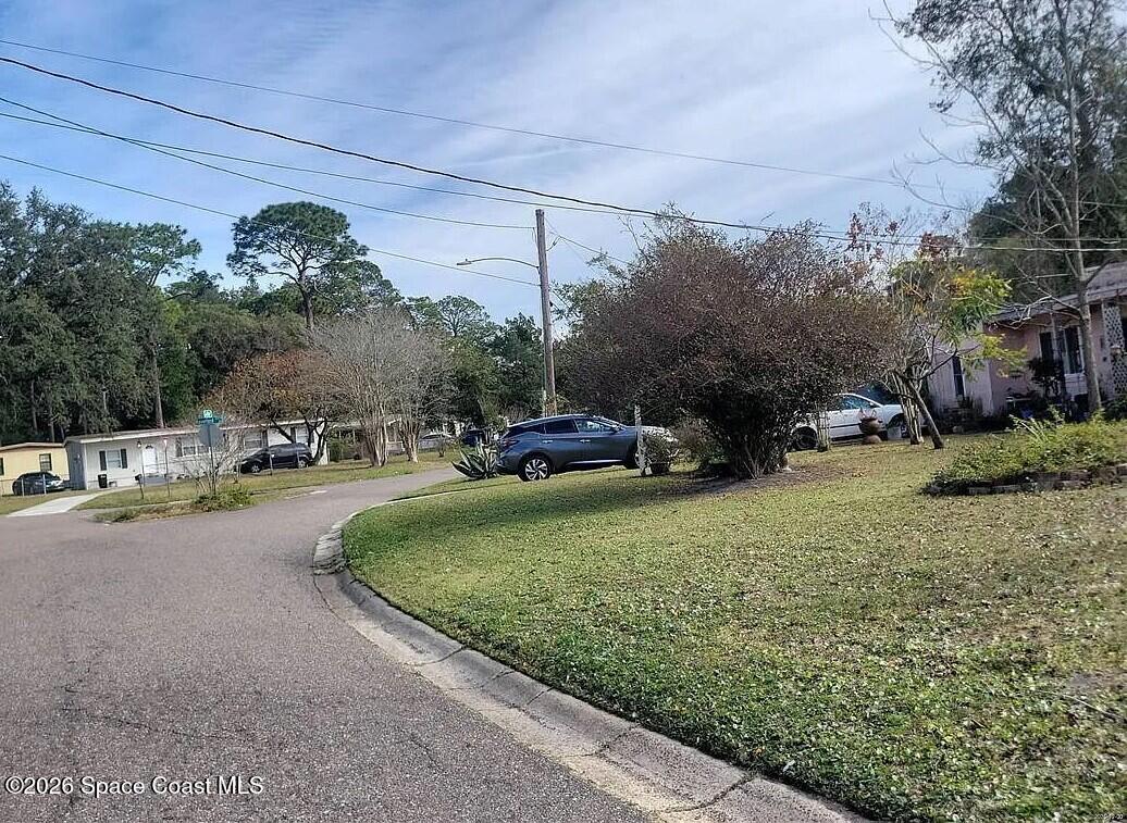 10127 Haverford Road Jacksonville, FL 32218 - Photo 5 of 6 a view of a street with a cars parked
