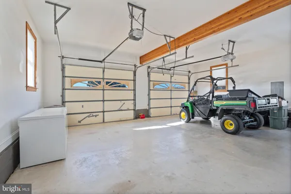 a room with a wooden floor and a window