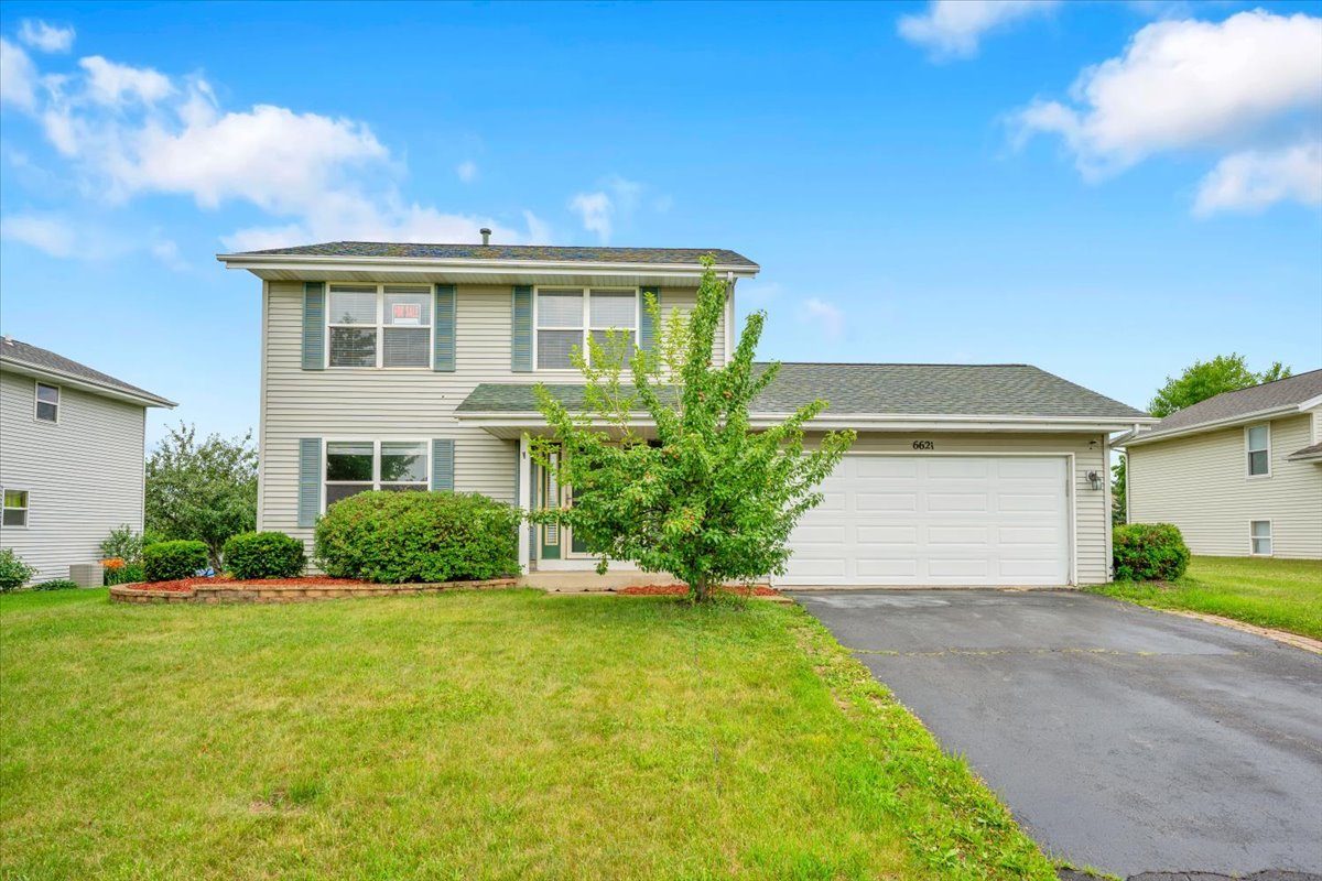 6621 Samantha Lane Rockford, IL 61107 - Photo 2 of 38 a front view of house with yard and green space