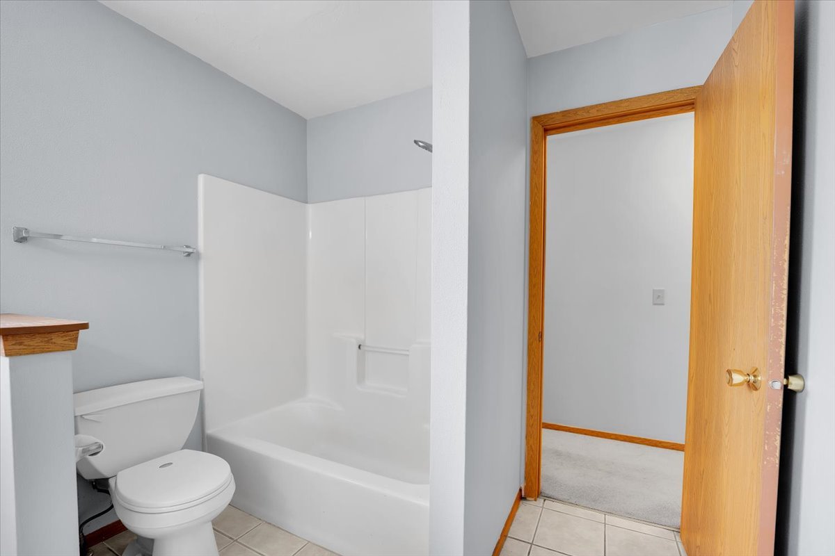 6621 Samantha Lane Rockford, IL 61107 - Photo 21 of 38 a bathroom with a toilet and a shower