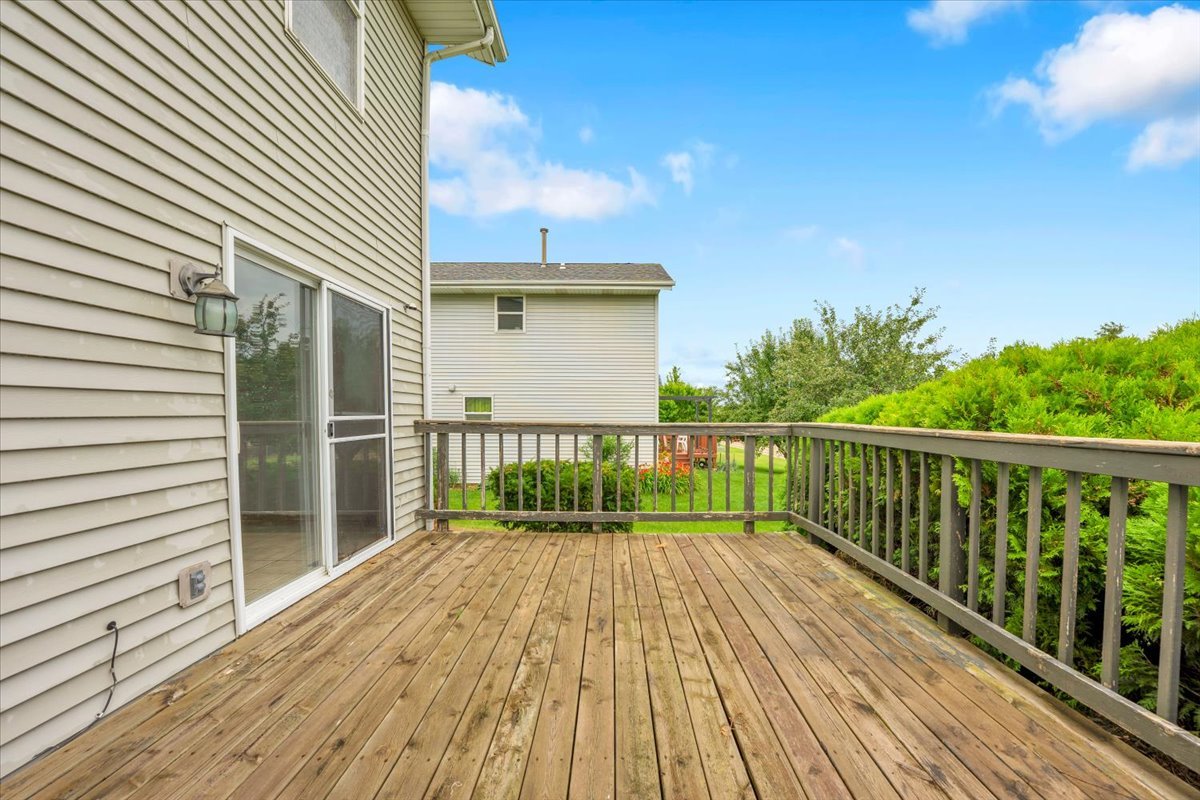 6621 Samantha Lane Rockford, IL 61107 - Photo 37 of 38 a balcony with a wooden floor