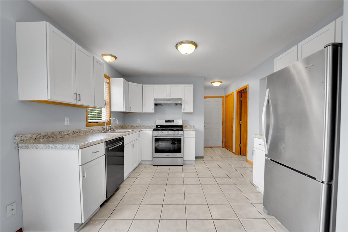 6621 Samantha Lane Rockford, IL 61107 - Photo 9 of 38 a kitchen with a refrigerator a sink and a stove