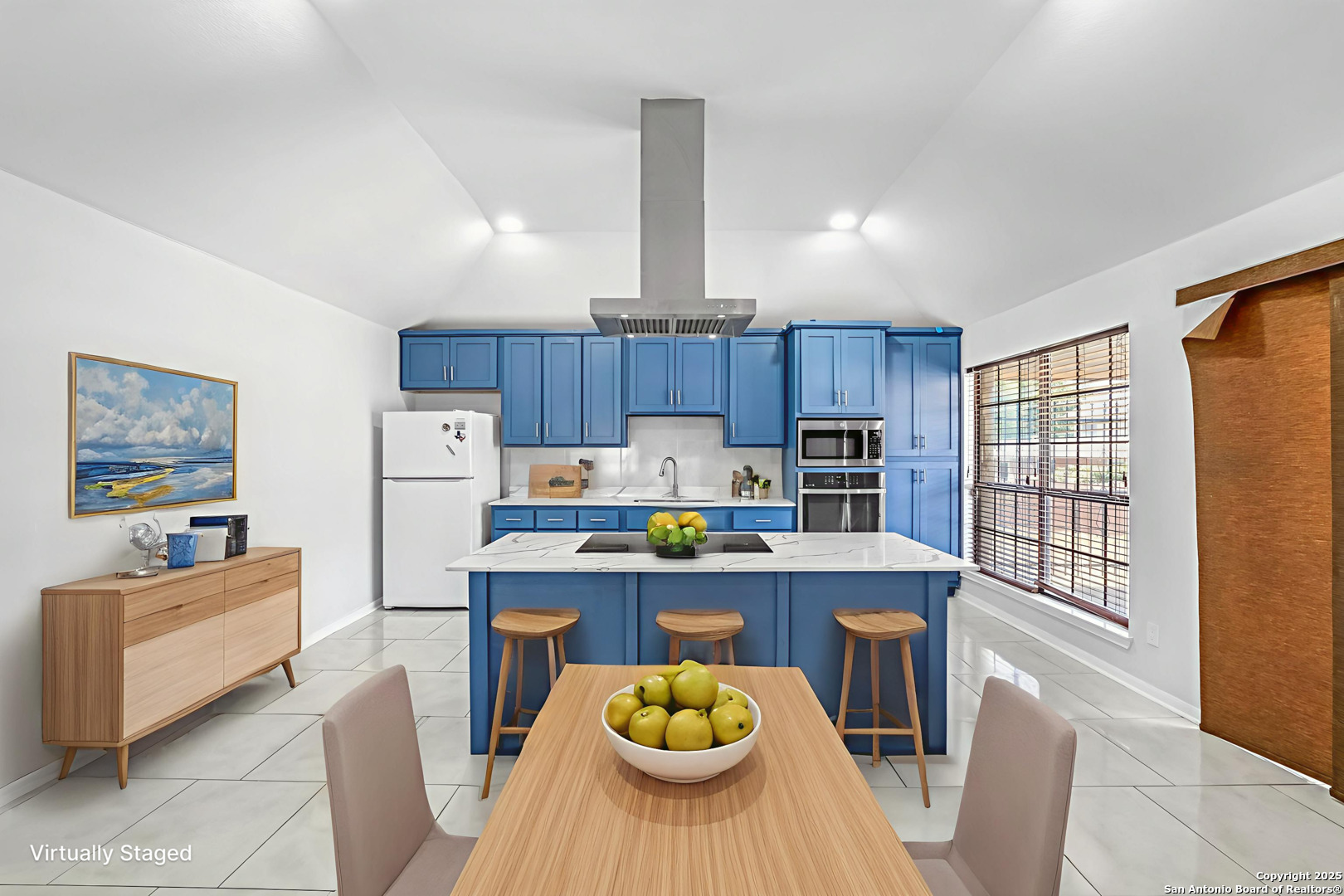 514 Jackson Keller Road San Antonio, TX 78216 - Photo 7 of 25 a kitchen with stainless steel appliances a table chairs and a refrigerator