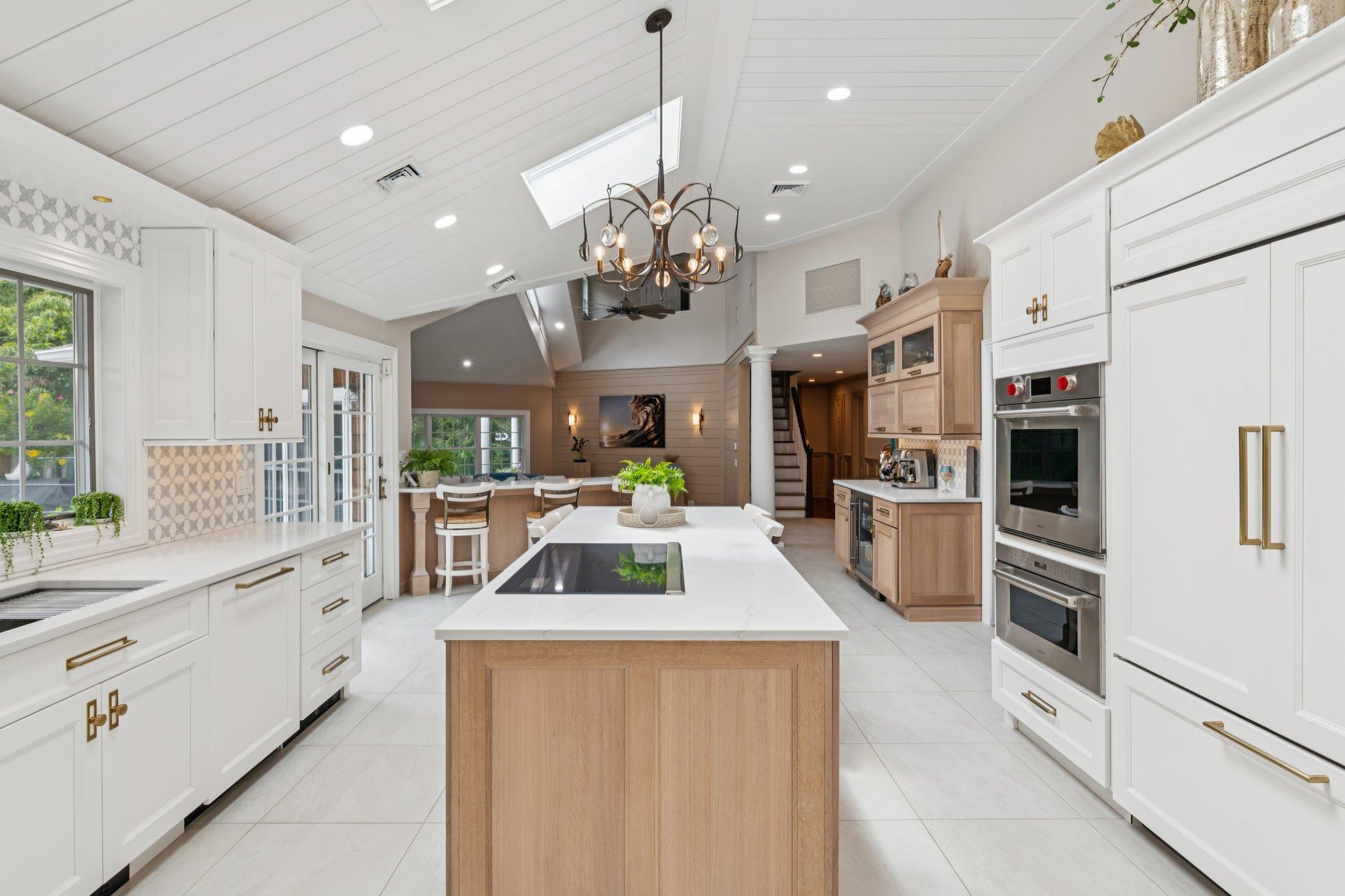 21 Inlet View Path East Moriches, NY 11940 - Photo 11 of 40 Kitchen with decorative columns, a kitchen island, decorative backsplash, recessed lighting, and light tile patterned flooring