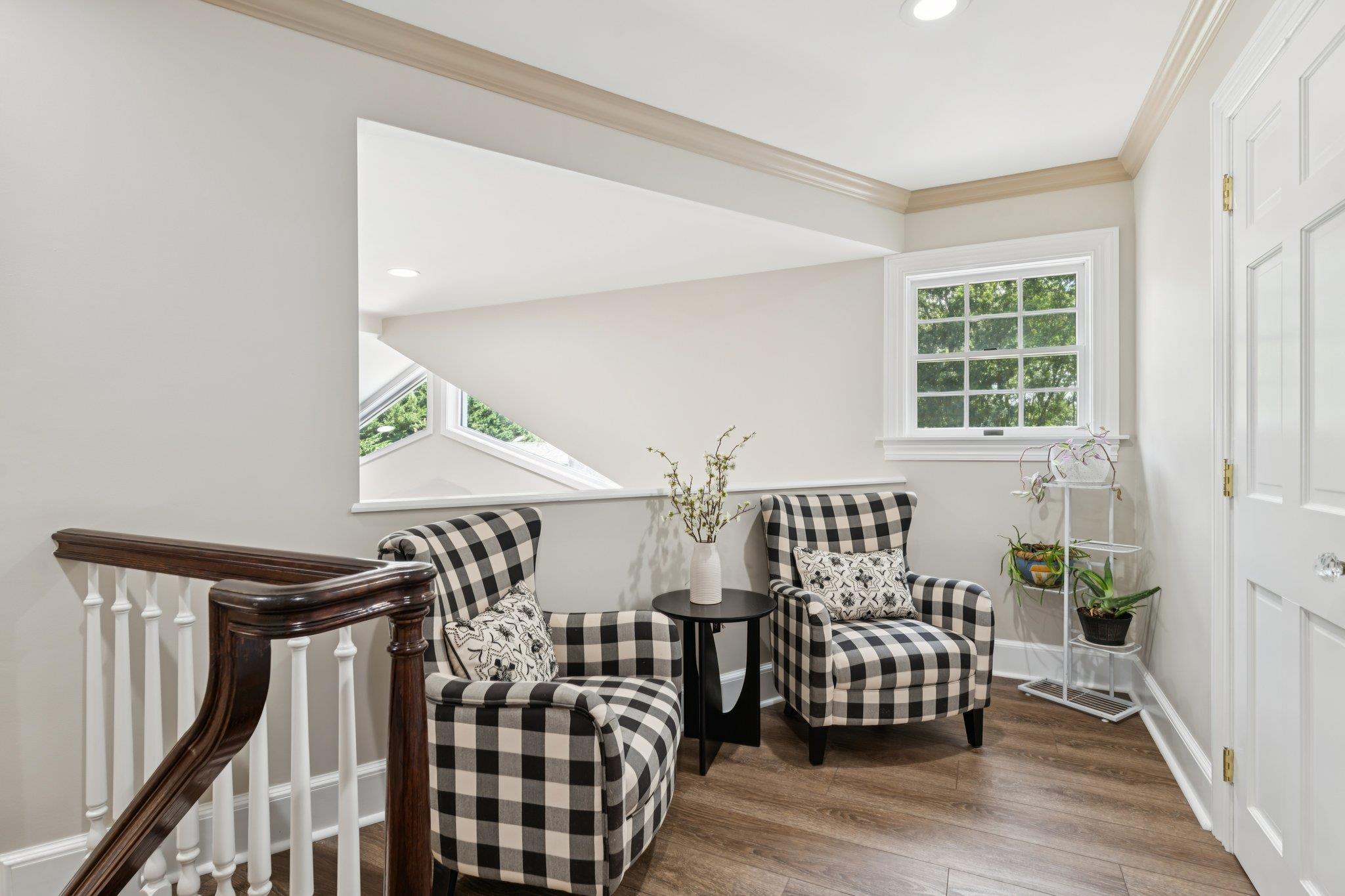 21 Inlet View Path East Moriches, NY 11940 - Photo 20 of 40 Living area with wood finished floors, crown molding, and recessed lighting