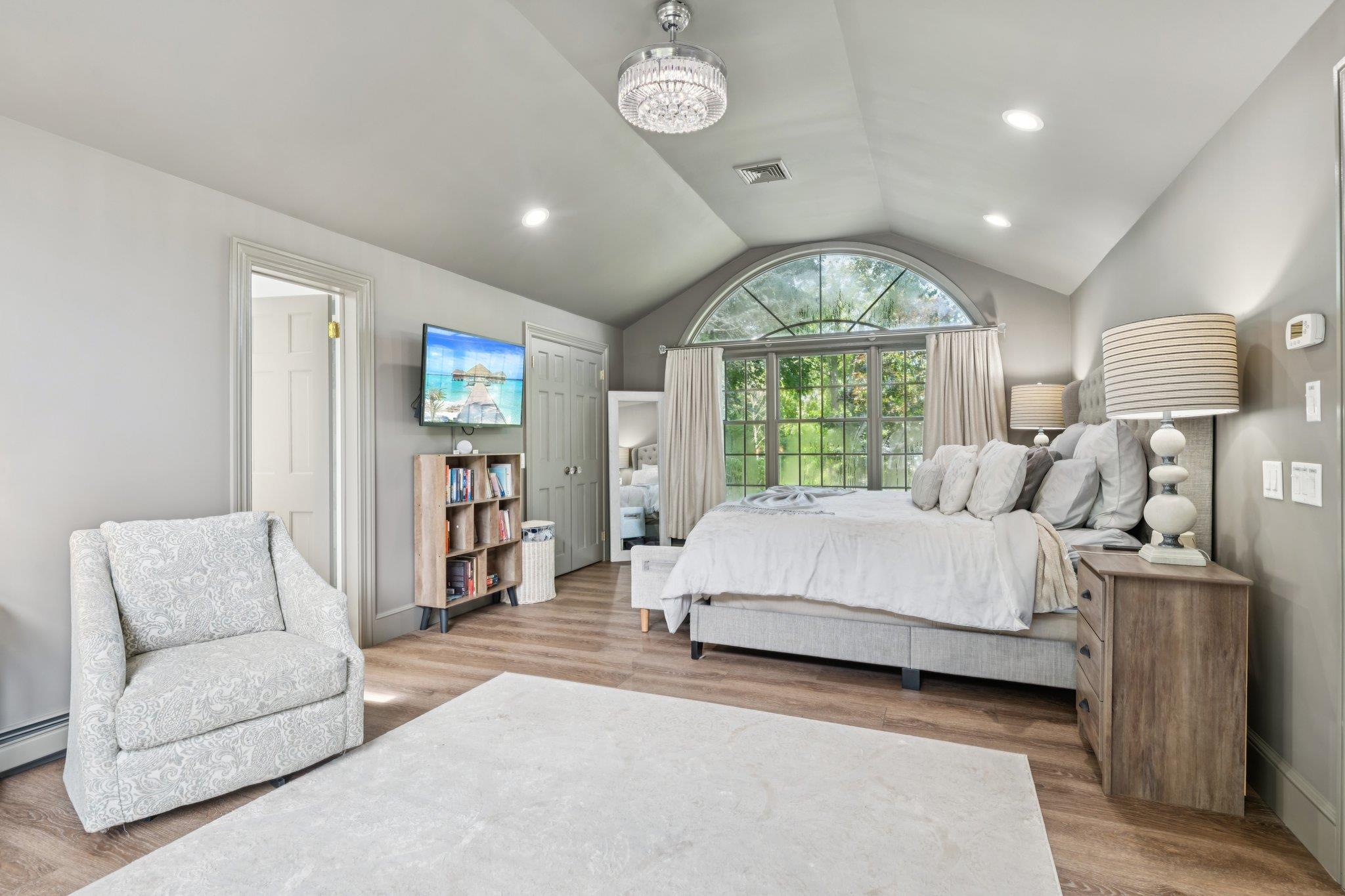21 Inlet View Path East Moriches, NY 11940 - Photo 21 of 40 Bedroom featuring lofted ceiling, wood finished floors, and recessed lighting