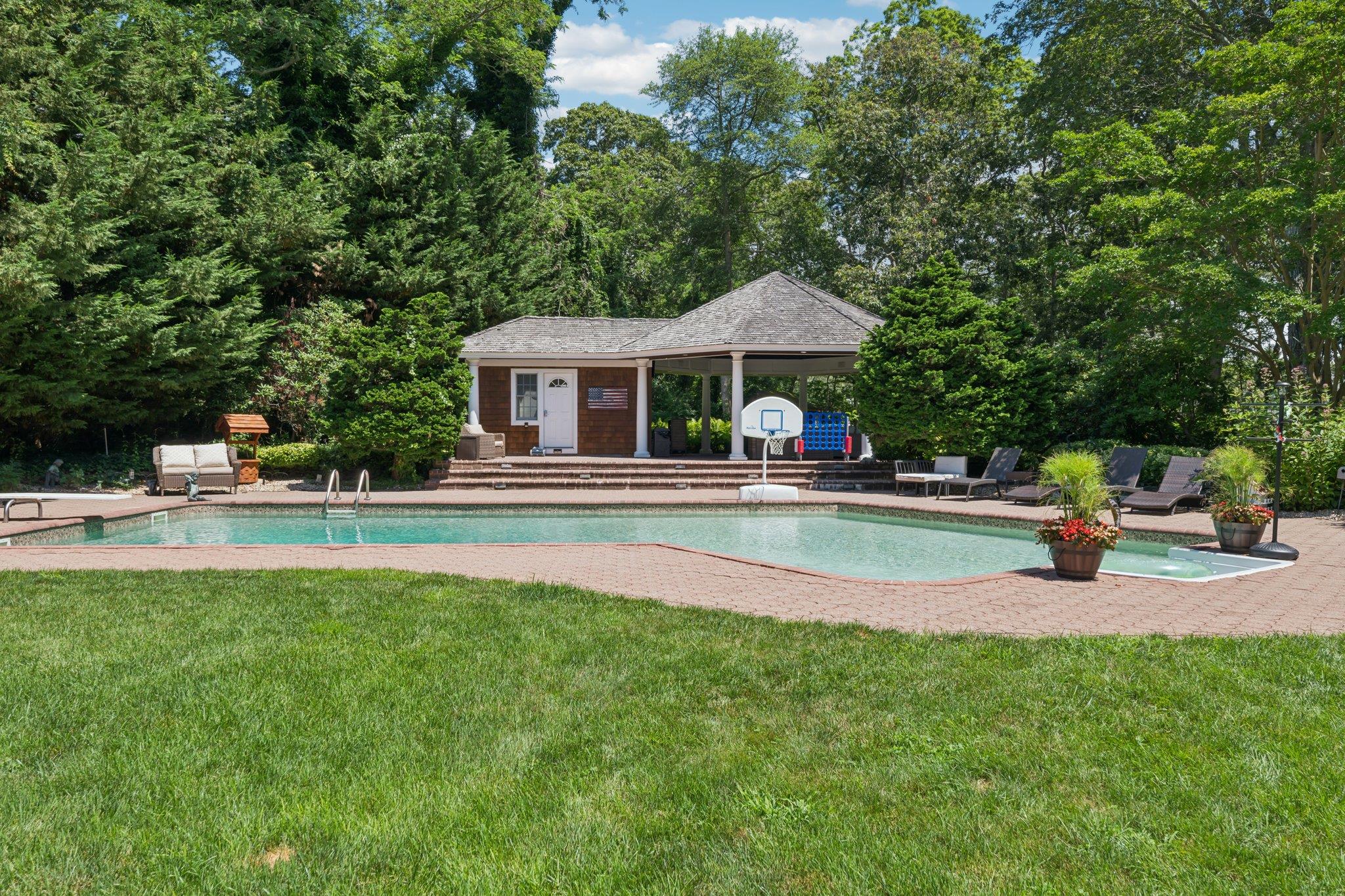 21 Inlet View Path East Moriches, NY 11940 - Photo 31 of 40 Outdoor pool with a patio area, a lawn, an outbuilding, and an exterior structure
