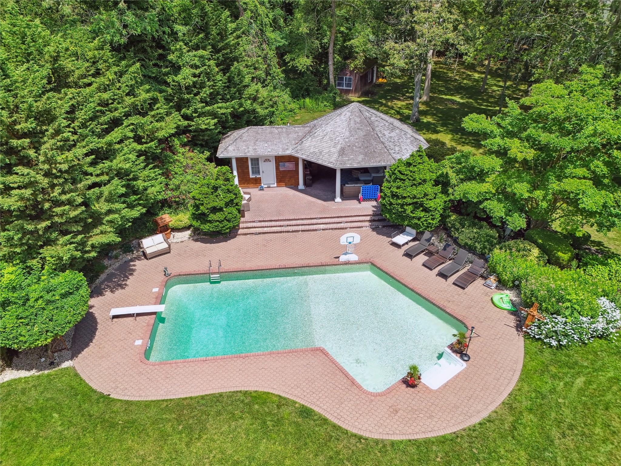 21 Inlet View Path East Moriches, NY 11940 - Photo 39 of 40 Swimming pool with an exterior structure, a patio, an outbuilding, and a diving board