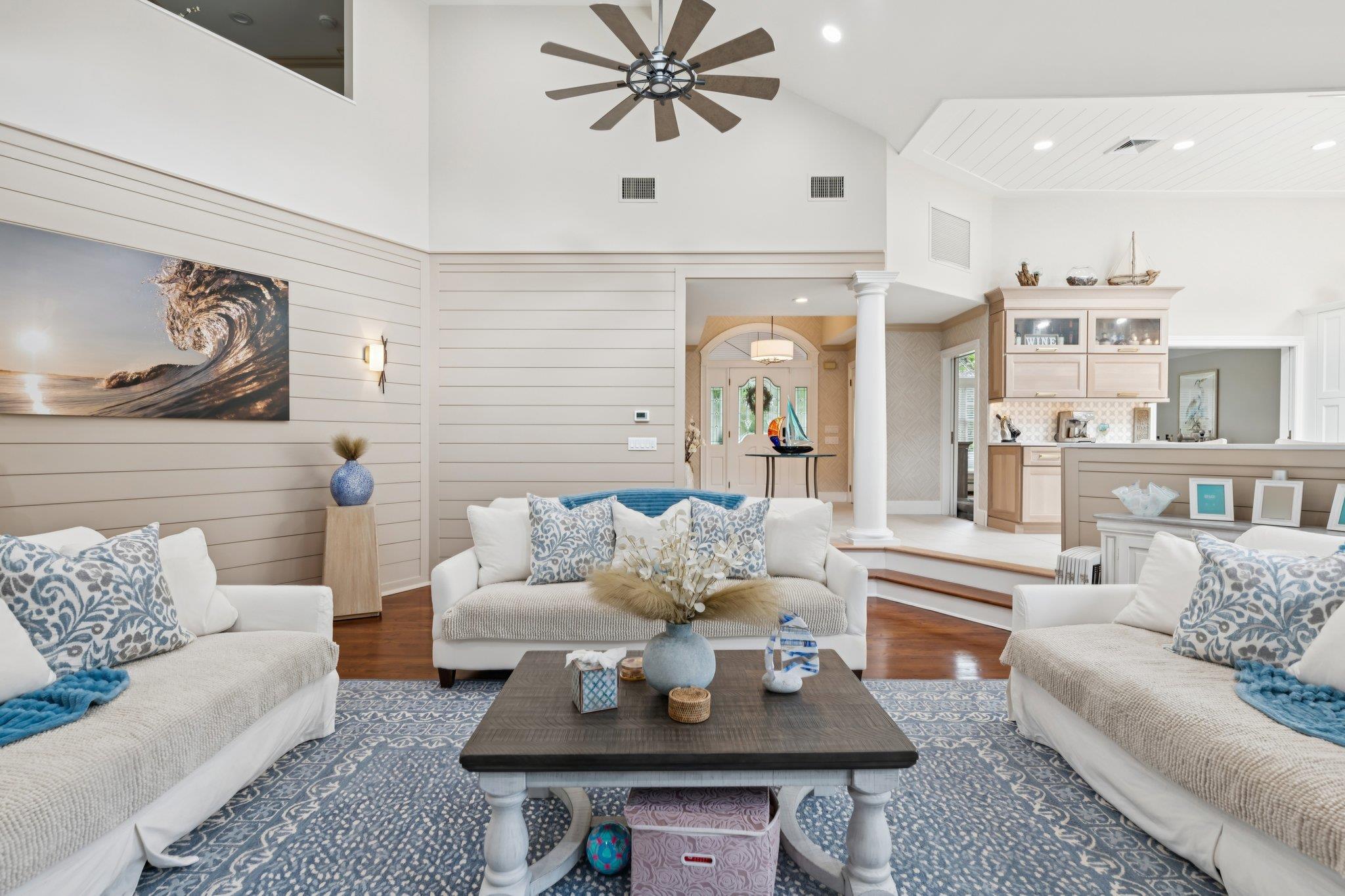 21 Inlet View Path East Moriches, NY 11940 - Photo 6 of 40 Living room with ornate columns, ceiling fan, dark wood-style floors, high vaulted ceiling, and recessed lighting