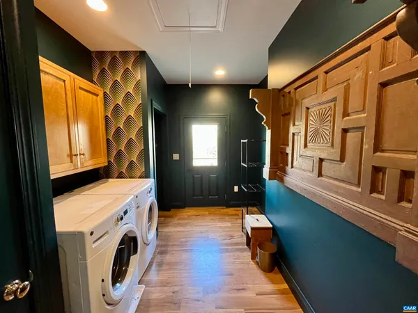 a view of a hallway with washer and dryer