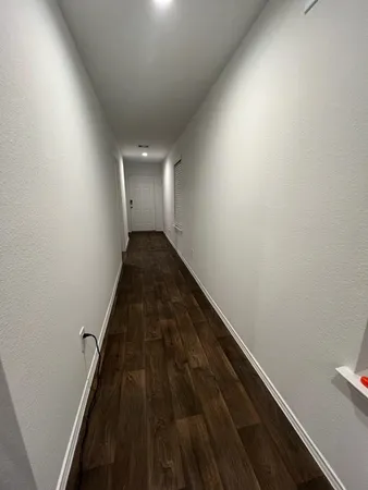 a bedroom with a bed and a table in it