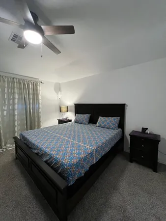 a bedroom with a bed and a cabinets