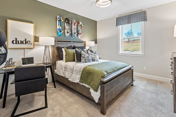 a bedroom with a bed and window