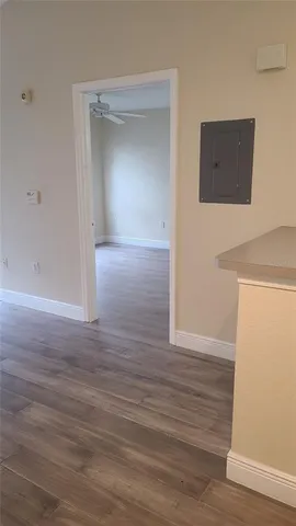 a view of hallway with wooden floor