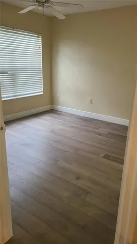 a view of an empty room with a window