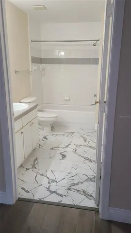 a bathroom with a sink toilet and vanity
