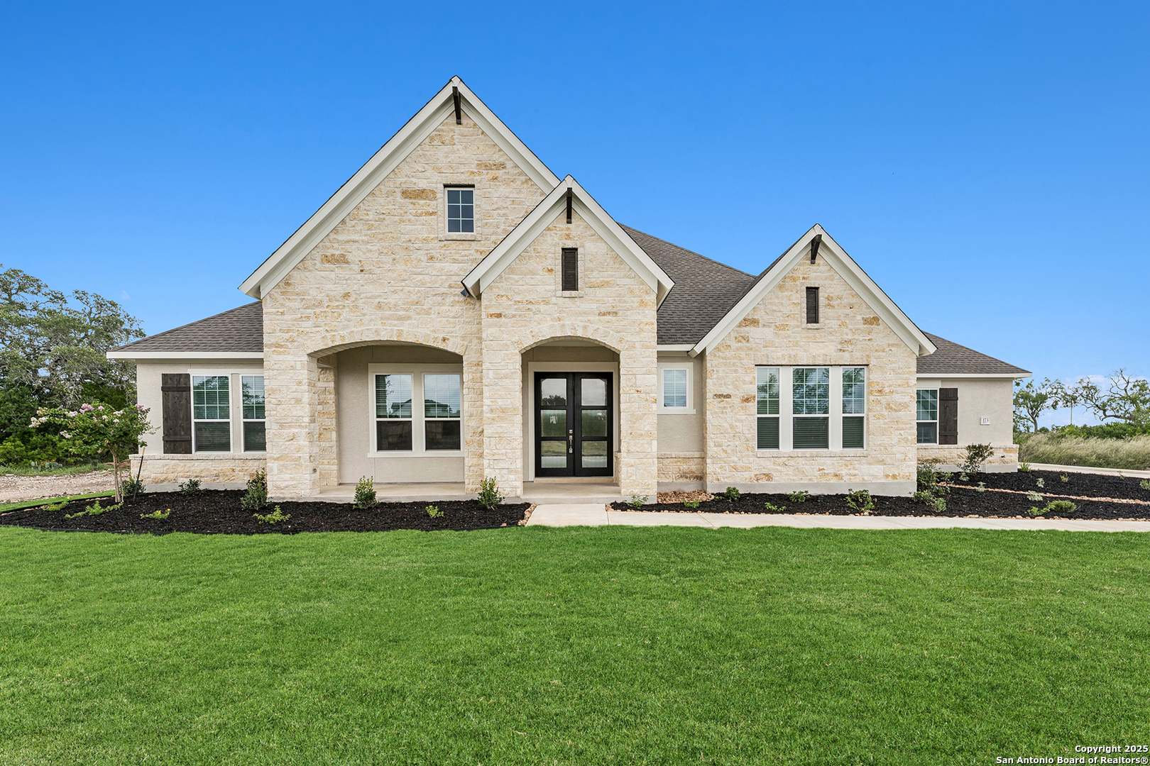 173 Christian Street Castroville, TX 78009 - Photo 1 of 1 a front view of a house with a yard
