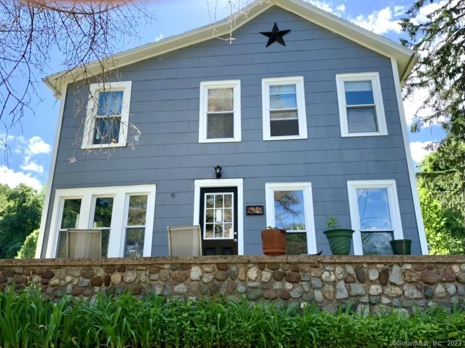 529 Millbrook Road Middletown, CT 06457 - Photo 1 of 1 a view of a brick house with large windows