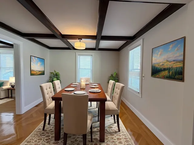a dining room with furniture and window