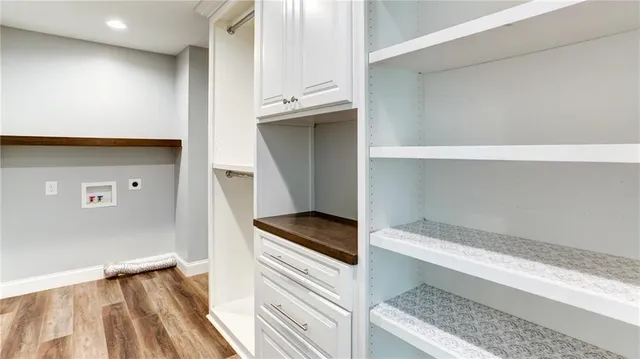 a bathroom with a granite countertop sink mirror toilet and bathtub